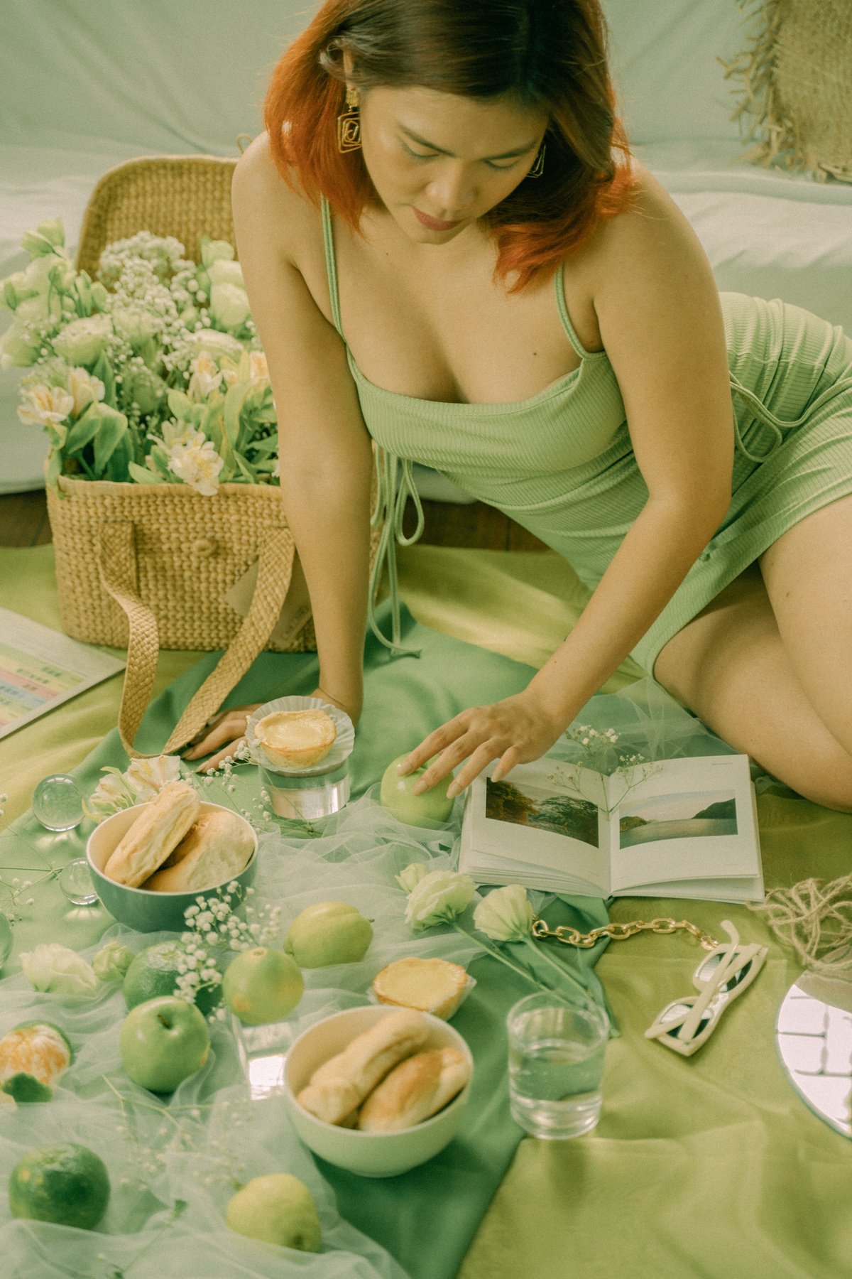 Woman Reading a Book Surrounded by Flowers and Fruits 